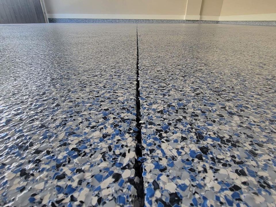 Blue, white & black flake, up close — a real floor finished by Epoxy Living