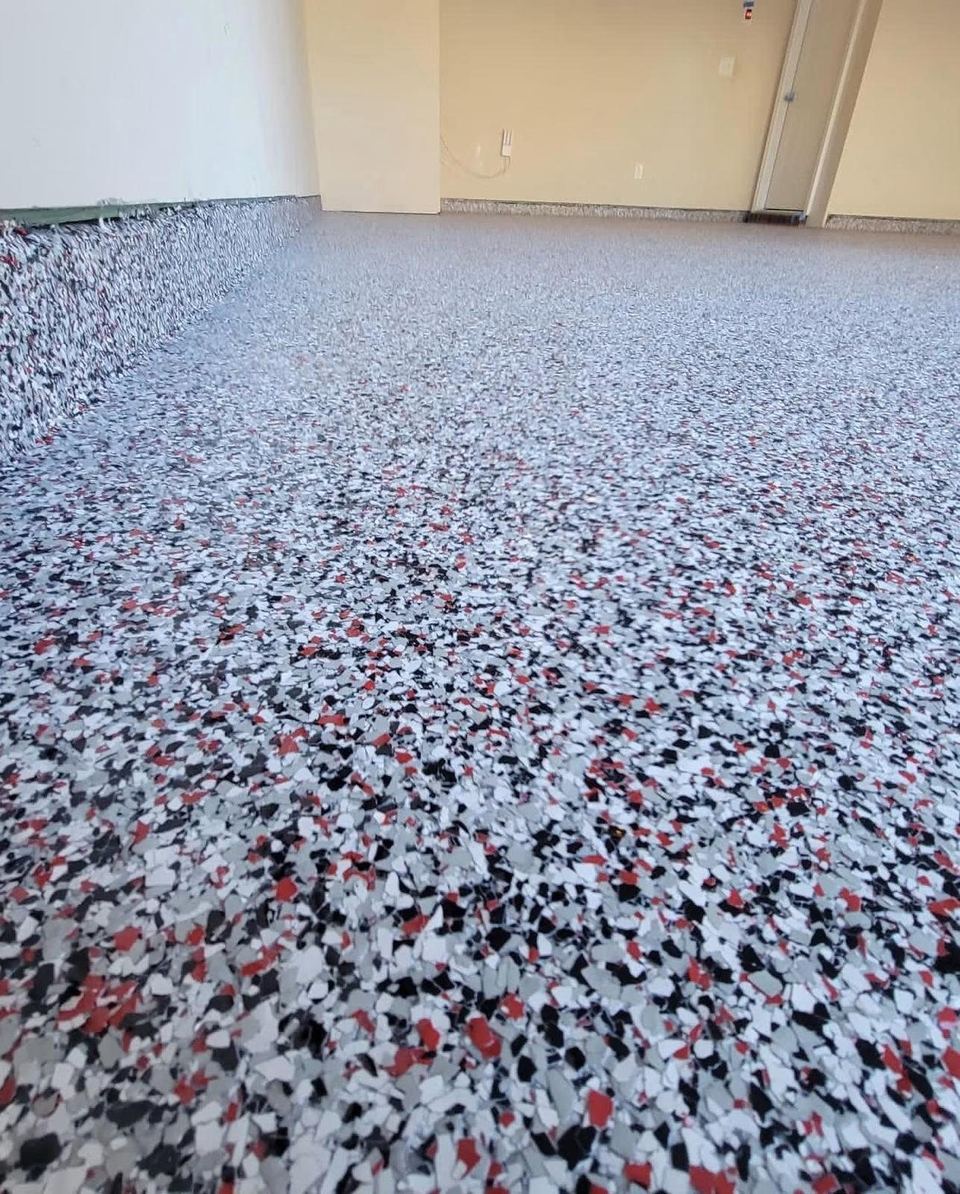Grey flake with red accents, garage — a real floor finished by Epoxy Living