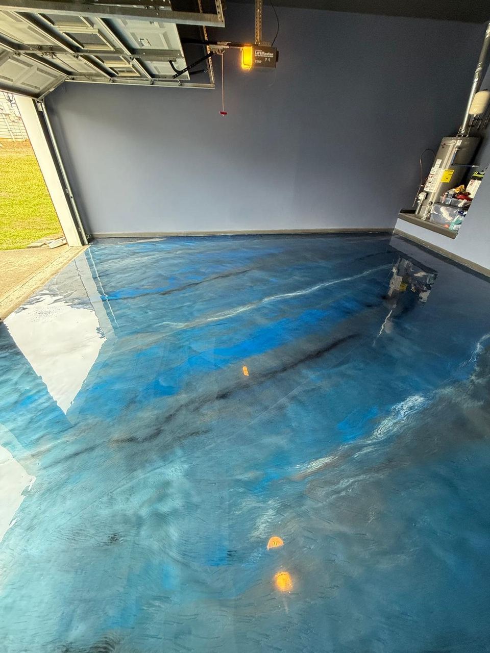 Blue metallic, garage — a real floor finished by Epoxy Living