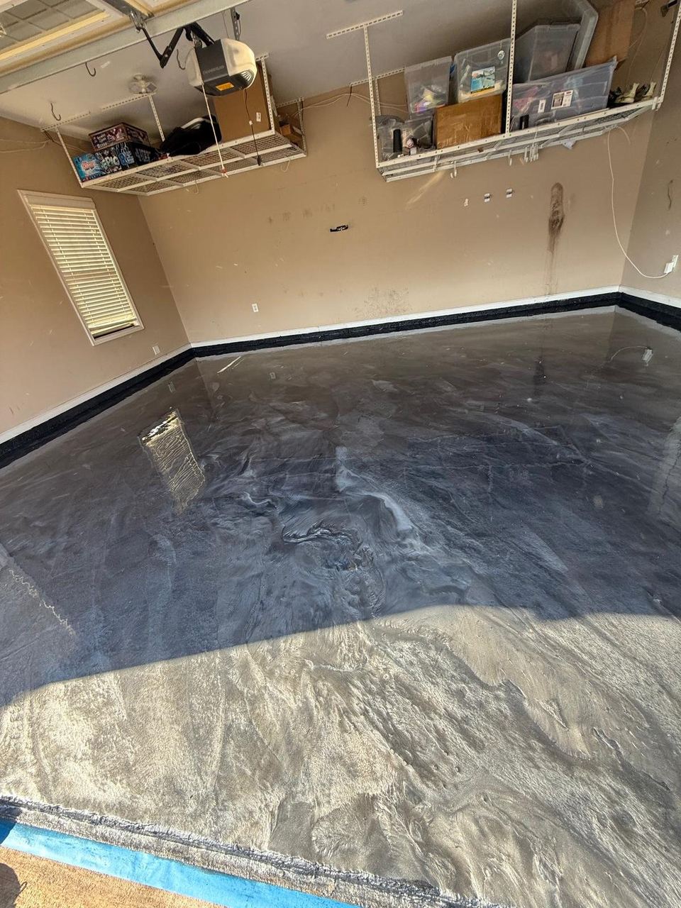 Grey metallic, garage with overhead storage — a real floor finished by Epoxy Living